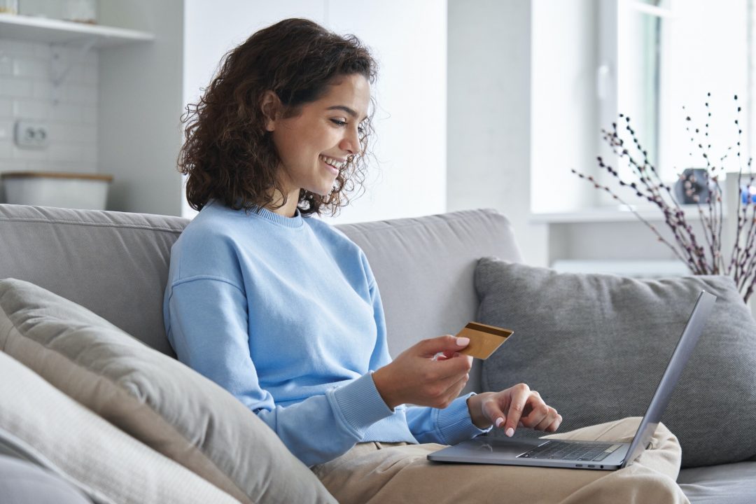 Happy family with son using mobile apps together at home